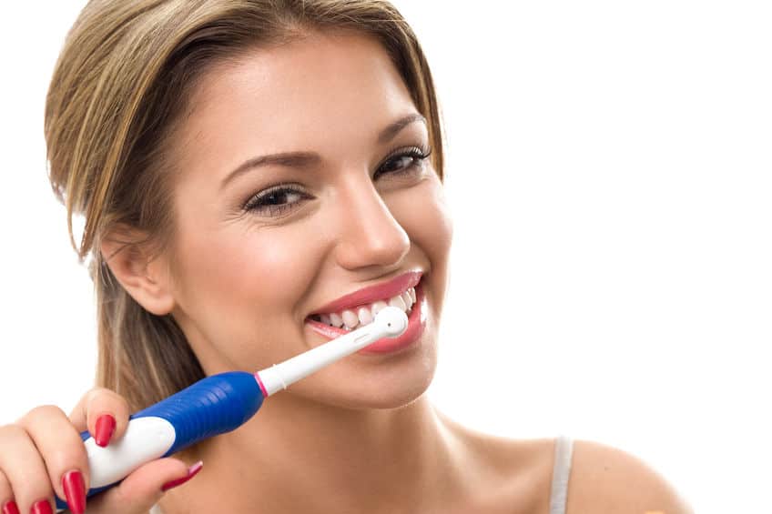 woman-brushing-teeth-with-best-electric-toothbrush