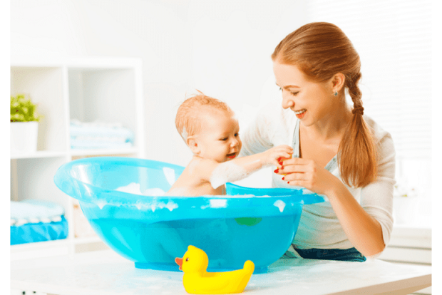 picture of a mom and a baby having a good time while bathing