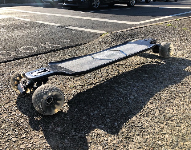 electric skateboard with cloud wheels on road 
