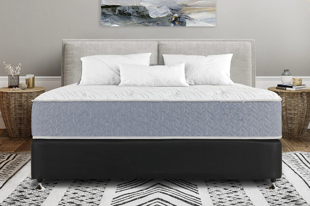 King-size bed with memory foam mattress in bedroom