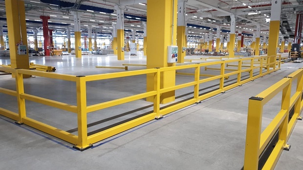 White safety barriers in warehouse