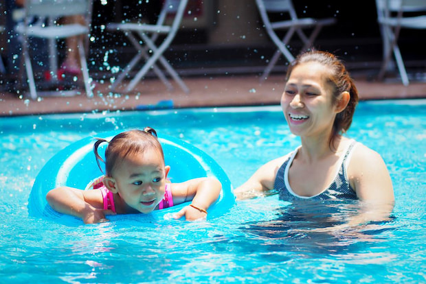 mother and her daughter in the pool